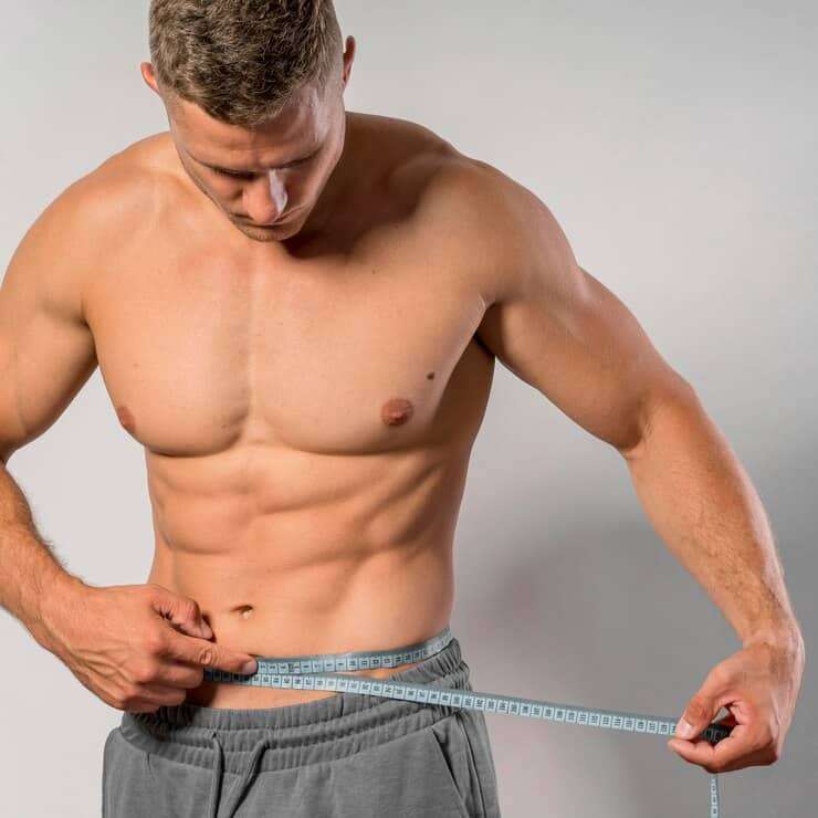 front-view-very-fit-man-holding-measuring-tape-around-waist_23-2148700649