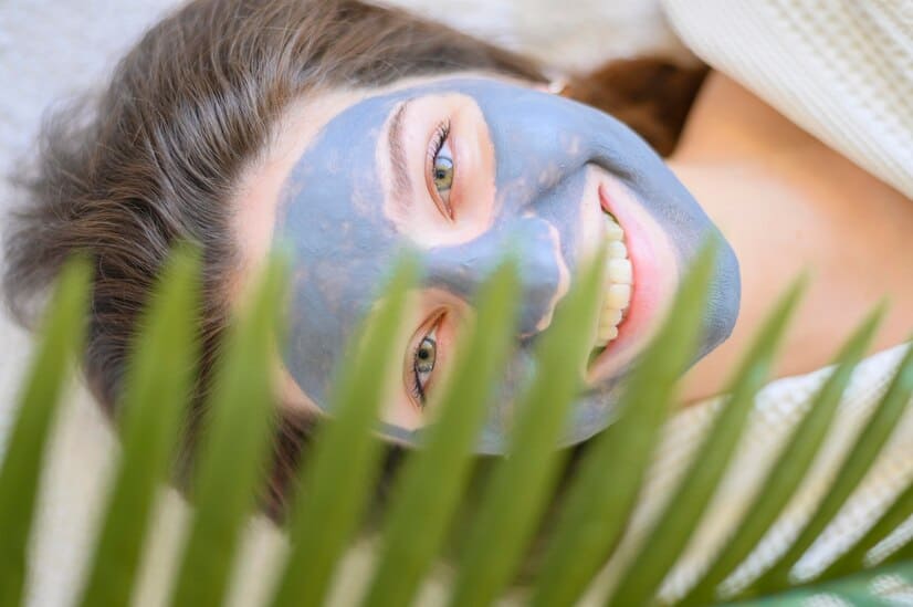 top-view-smiley-woman-with-face-mask_23-2148520307