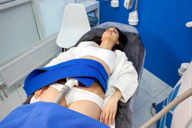 coolsculpting-procedure-cosmetology-clinic-girl-patient-lies-couch-connected-machine_164411-3334