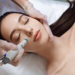 professional-female-cosmetologist-doing-hydrafacial-procedure_302872-23
