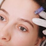 young-woman-getting-facial-skincare-treatment_130388-803